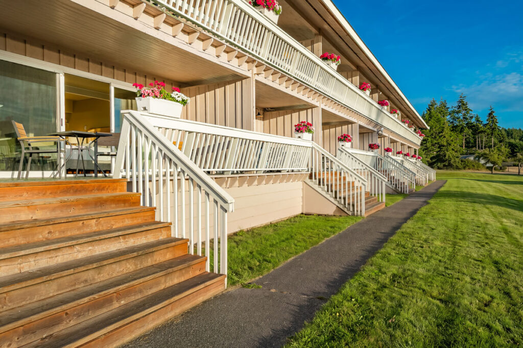 Spacious Orca Deluxe Room featuring a comfortable king-sized bed at Lopez Islander Resort.
