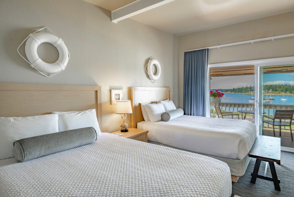 Spacious Coho Room at Lopez Islander Resort featuring two comfortable queen-sized beds.