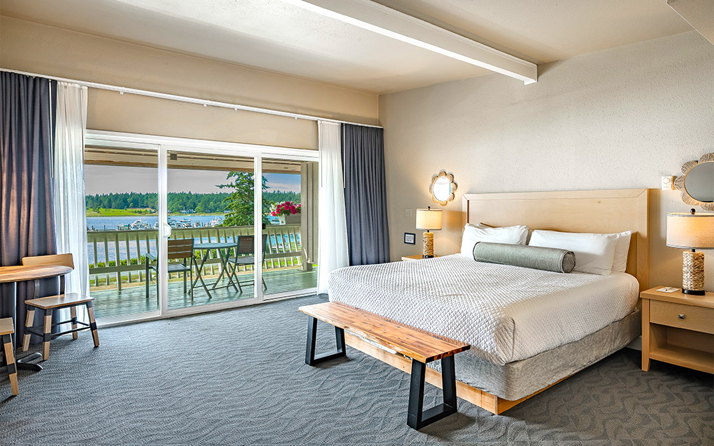 Close-up of the plush king-sized bed and premium linens in the Orca Deluxe.